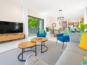 a living room with a couch and a table at SALTA apartment l Complex Ocean terraces in Poste Lafayette
