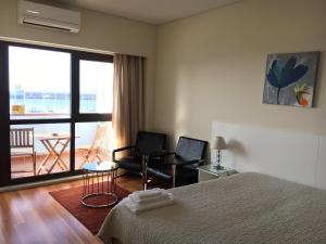 A bed or beds in a room at Solmar Alojamentos