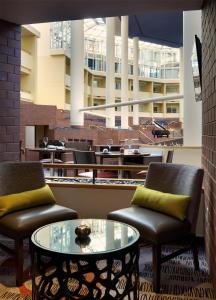 a room with two chairs and a table and a building at Hyatt Regency Princeton in Princeton