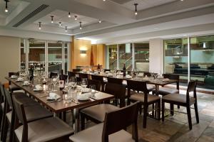 a dining room with a long table and chairs at Hyatt Regency Princeton in Princeton