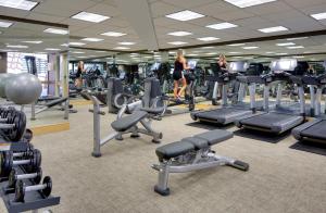 a gym with rows of treadmills and machines at Hyatt Regency Princeton in Princeton