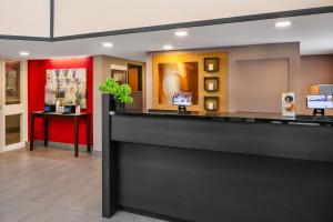 a lobby of a hotel with a reception desk at Comfort Inn Sydney - Cape Breton in Sydney