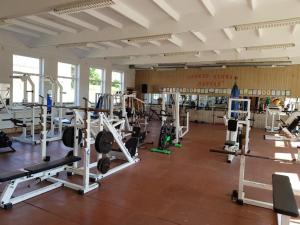 a gym with a lot of equipment in a room at Marsas 2 in Zarasai +3 photos