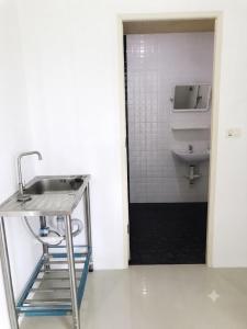 a bathroom with a sink and a toilet in a room at DM udon in Udon Thani +27 photos