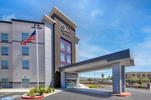a rendering of a hotel with an american flag at Sleep Inn & Suites Henderson - Las Vegas in Henderson