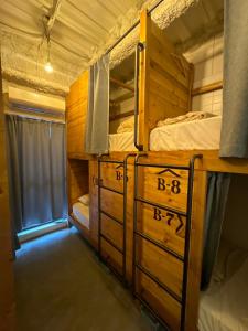 a room with two bunk beds and a window at Asagaya Iriguchi in Tokyo