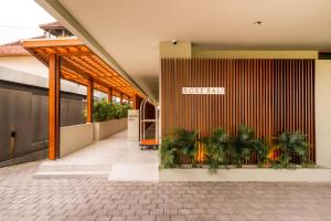 a store front with plants in front of it at Sore Escape Tumbak Bayuh by Betterplace in Canggu +61 photos