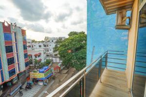 an apartment balcony with a view of a street at Hotel Sea Wood in Digha