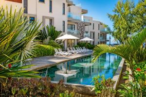 an image of a swimming pool at a hotel at SALTA apartment l Complex Ocean terraces in Poste Lafayette