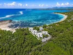 an aerial view of a resort on a beach at SALTA apartment l Complex Ocean terraces in Poste Lafayette