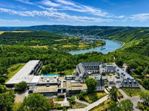 an aerial view of a building next to a river at Jakobsberg Nature Resort - Hotel & Golf in Boppard