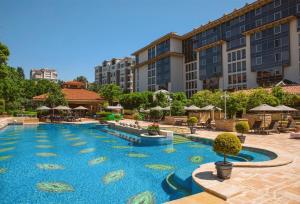 a large swimming pool in front of a building at Grand Hyatt Istanbul in Istanbul