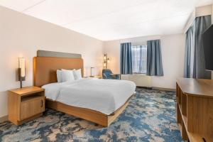 a hotel room with a bed and a desk at Hampton Inn Schenectady Downtown in Schenectady