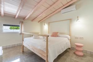 a bedroom with a bed and a window at Raízes 22 - Apartamento 6 in Puebla de Don Fadrique +23 photos