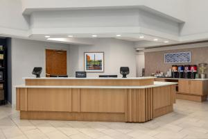 a lobby with a reception desk and a pharmacy at Hampton Inn Springfield-South in Springfield +24 photos