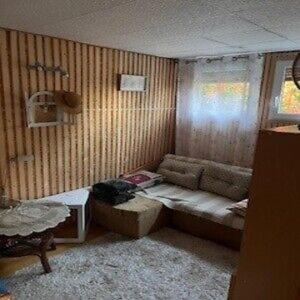 a small room with a couch and a window at Ostrzycki Raj in Pierszczewo +1 photo