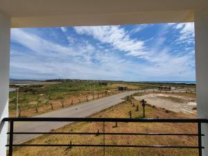 a view of a road from a balcony at la vue coucher de soleil in Hauara