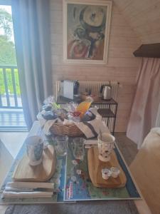 a living room with a table with two wooden trays at La Crinière d'Or - Entre mer et campagne in Bonneville-la-Louvet +11 photos