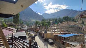 a view of a town with mountains in the background at Mirza Luxe Inn Astore in Astor +19 photos