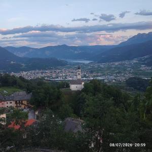 a view of a town with a church and a city at Nonna Evy in Pergine Valsugana