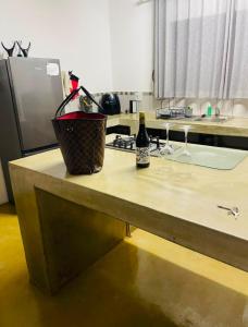 a bottle of wine sitting on a counter in a kitchen at Bushbuck Rest in Marloth Park +56 photos