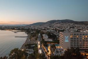 an aerial view of a city and the water at Divani Apollon Palace & Thalasso in Athens