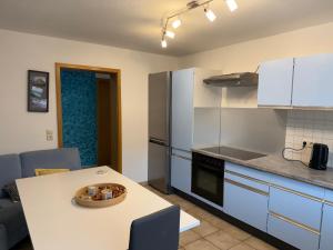 a kitchen with a bowl of food on a table at Wohnen am Rande des Schwarzwaldes in Eggingen
