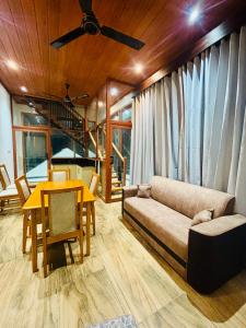 a living room with a couch and a table at SB Guest in Trincomalee