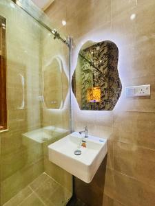 a bathroom with a sink and a shower at SB Guest in Trincomalee