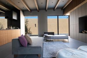 a living room with a couch and a table at BLUE BLACK blue black in Karatsu