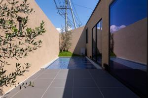 an external view of a house with a swimming pool at BLUE BLACK blue black in Karatsu
