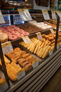 a bakery filled with lots of different types of pastries at Lebeco Apartman in Kolárovo