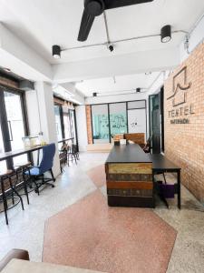 an office with a table and chairs and a brick wall at Sukhum Ratchada Sutthisan in Bangkok +50 photos