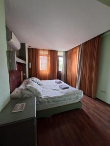 a bedroom with a bed and a desk in it at Miji Stay in Fethiye