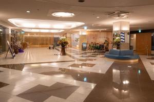 a lobby of a hotel with a large lobby at Boyokaku in Amakusa