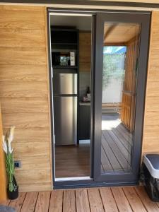 a sliding glass door of a kitchen in a house at Mobile Home Drage Tara in Drage
