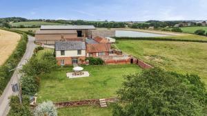 an aerial view of a house on a grass field at Knights Farm in Ipswich