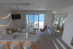a living room with a view of the ocean at Three Drops in Kanala