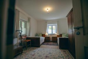 a hotel room with a bed and a window at Ferienhaus Allmunzen in Witzmannsberg +29 photos