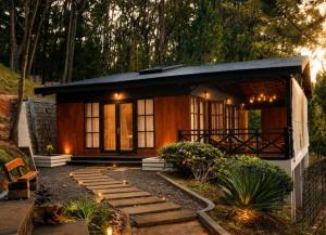 a small house with a pathway in front of it at Lake House Mantasoa in Mantasoa