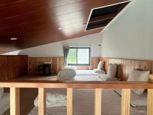 a bedroom with a large bed in a room at 自在居森林民宿 in Wufeng +5 photos