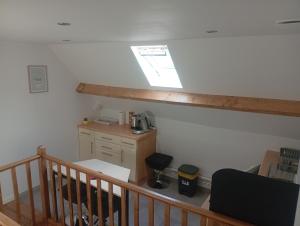 a room with a staircase with a desk and a window at Cote d'opale Terre & Mer in Outreau +5 photos