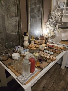 a table with a buffet of food on it at B&B Cimatori in Florence