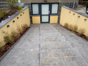 a walkway leading to the front door of a house at Comfortable Apartment in Waterloo with Jacuzzi - 78m² in Waterloo