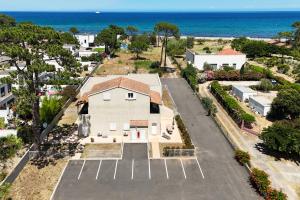 an aerial view of a house with the ocean in the background at Futura 2 in Borgo