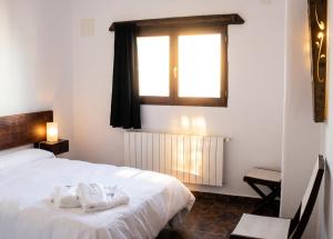 a bedroom with a white bed and a window at Spacious Apartment in Yeste with Shared Pool in Yeste +17 photos