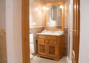 a bathroom with a sink and a mirror at Charming Villa with Private Pool in La Calzada de Béjar in La Calzada de Béjar