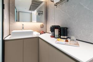 a bathroom with a sink and a counter top at Futura 2 in Borgo +7 photos