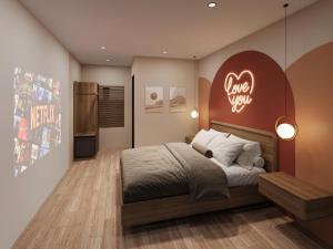 a bedroom with a bed with a heart sign on the wall at Sanora Hotel in Hanoi
