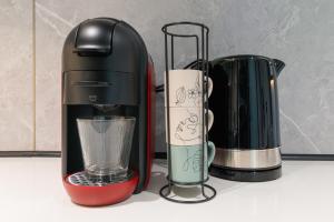a coffee maker and a blender on a counter at Futura 2 in Borgo